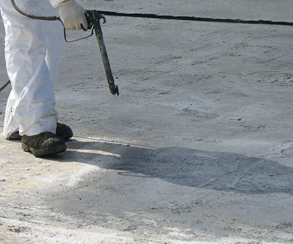 primer applied to roofing surface for spray foam roof